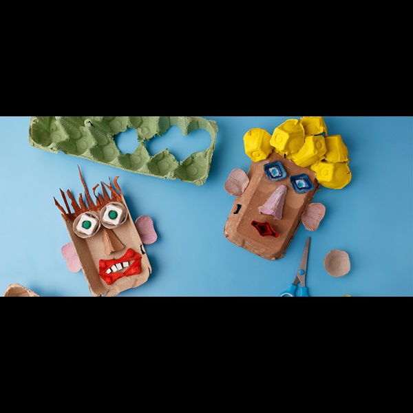 Handmade face puppets made from egg cartons.