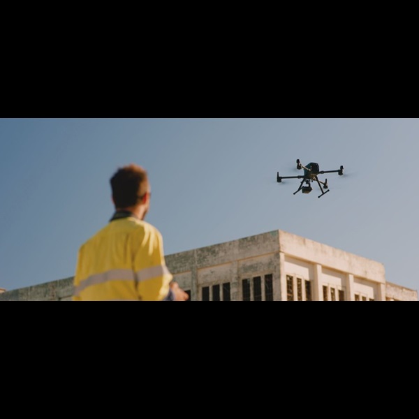 Drone operator and drone outside East Perth Power Station.