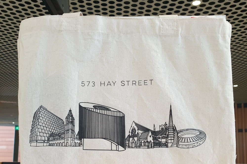 A library bag featuring the City of Perth Library and surrounding buildings