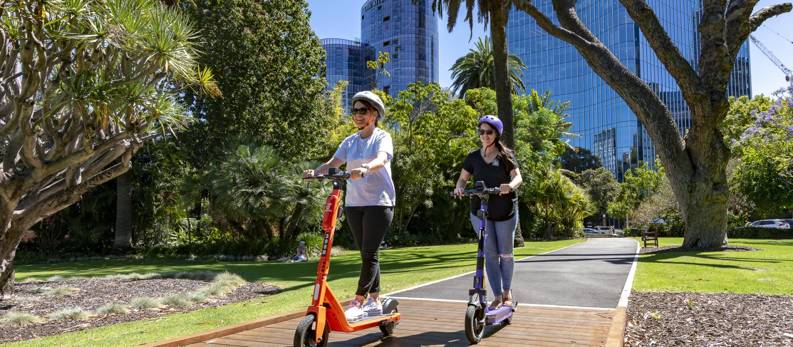 People riding e-scooters
