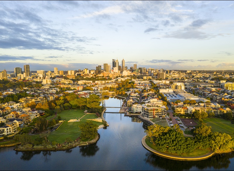 Aerial shot of Claisebrook Cove in East Perth showing water, bridges, gardens and City in the background