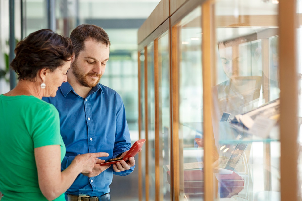Staff admiring memorabilia