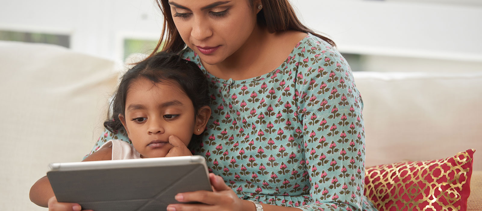 Mother and child watching storytime on tablet
